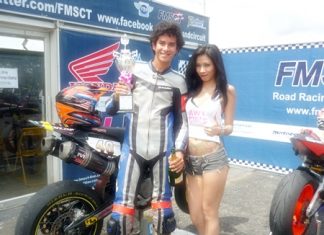 Ben Fortt holds the trophy after his win at the Thailand circuit, Sunday, Sept. 18.